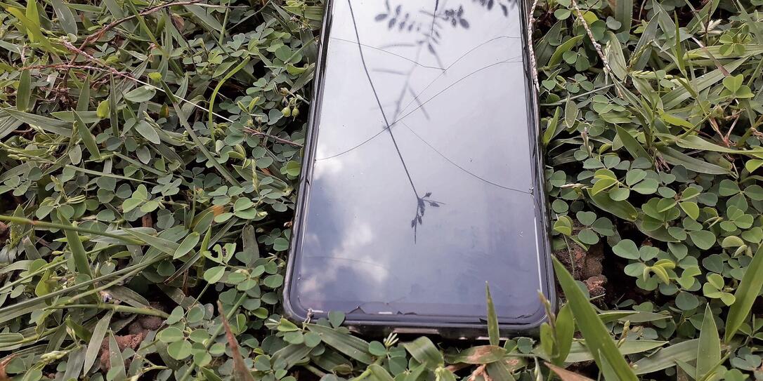 Mobile phone drop in ground, smartphone drop in ground. Wireless technology device.