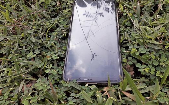 Mobile phone drop in ground, smartphone drop in ground. Wireless technology device.