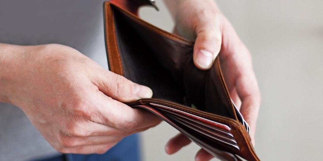 Empty wallet in the hands of an elderly man. Business concept. Empty wallet in the hands of an elderly man. Business concept.