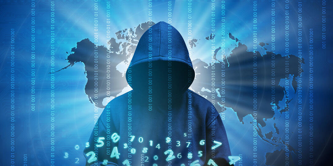 Computer hacker silhouette of hooded man