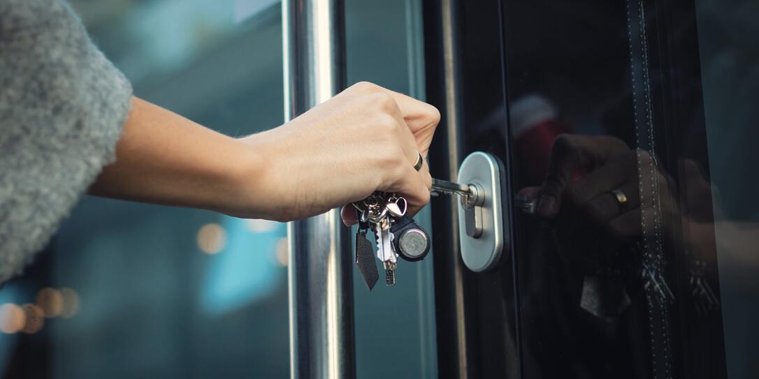 Locking door with a key.