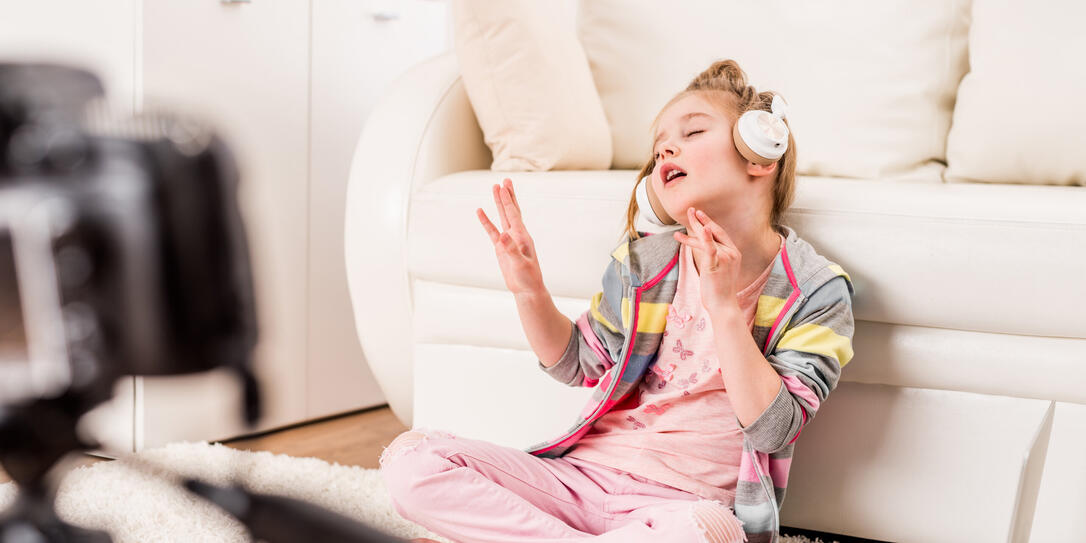Little girl recording video