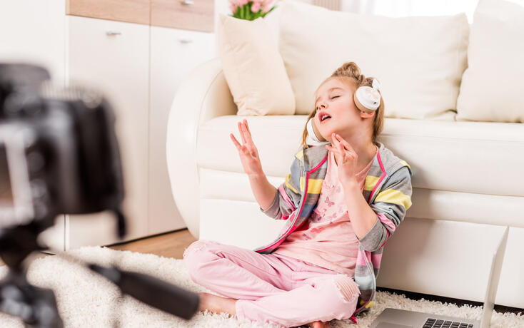Little girl recording video