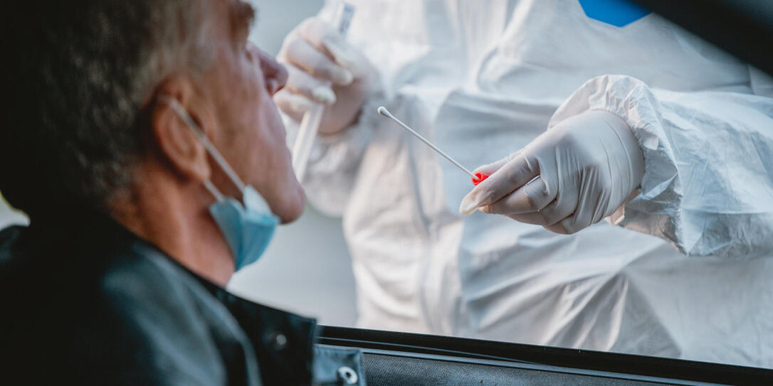 Senior Male Car Passenger at Drive Thru Medical Test Site