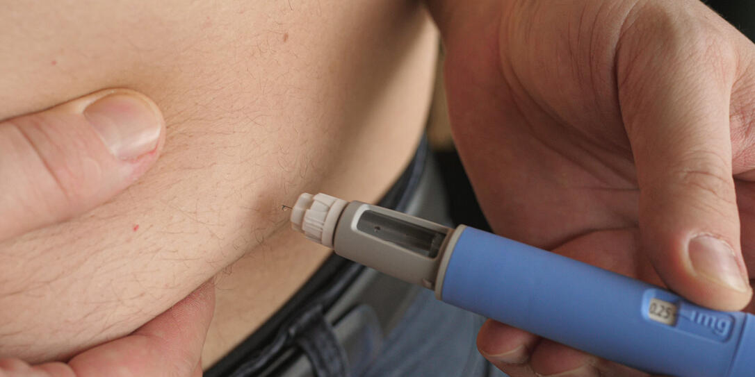 obese fat man injecting Semaglutide Ozempic injection control blood sugar levels