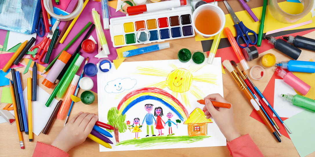 family on meadow with rainbow and house child drawing