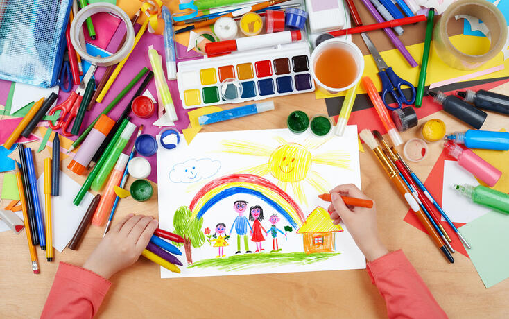 family on meadow with rainbow and house child drawing