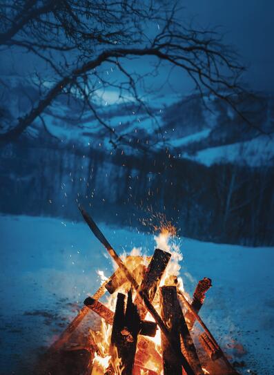 Winter campfire in the top of the mountains at the evening.