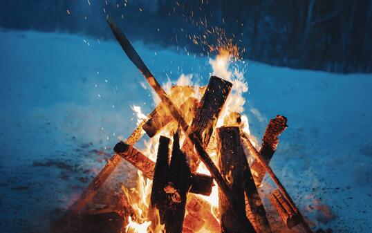 Winter campfire in the top of the mountains at the evening.