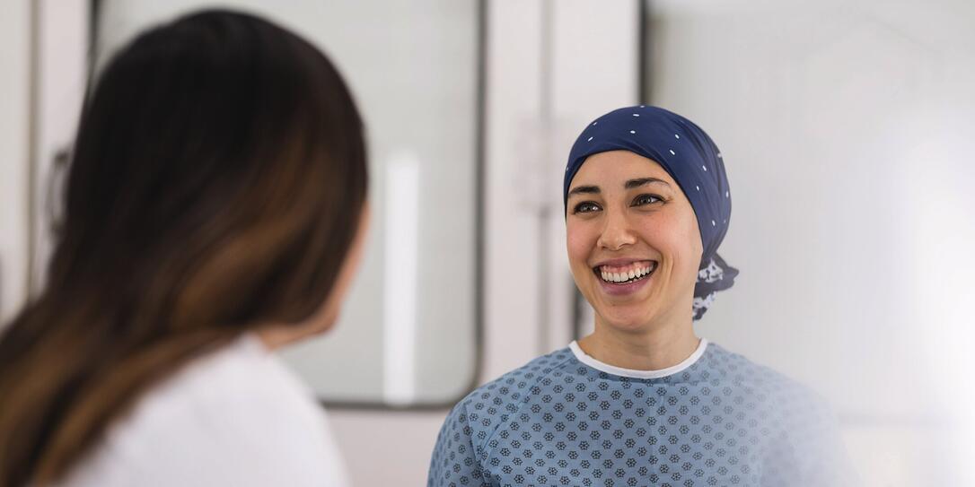 Young female cancer patient meets with her doctor