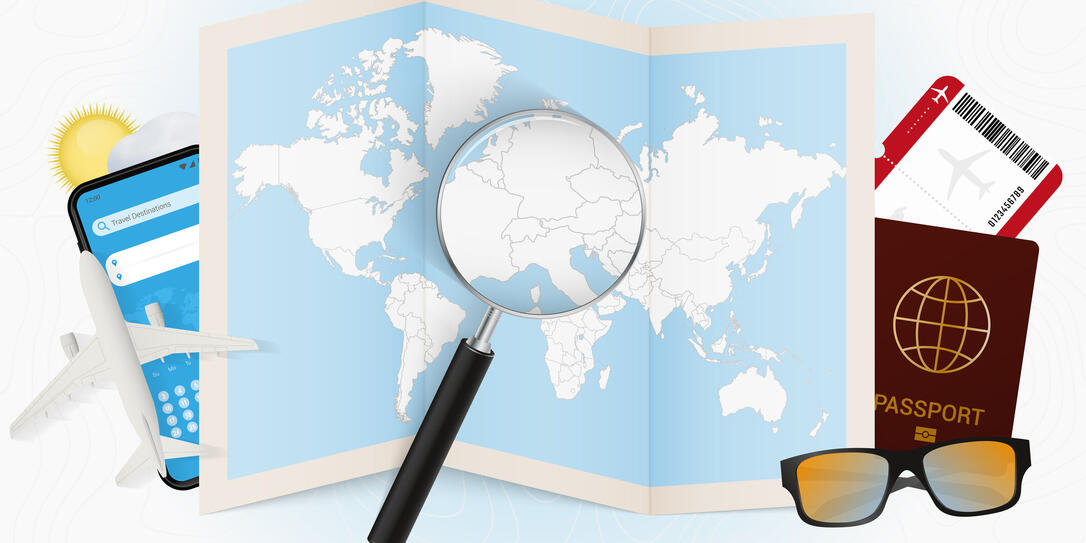 Travel destination Liechtenstein, tourism mockup with travel equipment and world map with magnifying glass on a Liechtenstein.