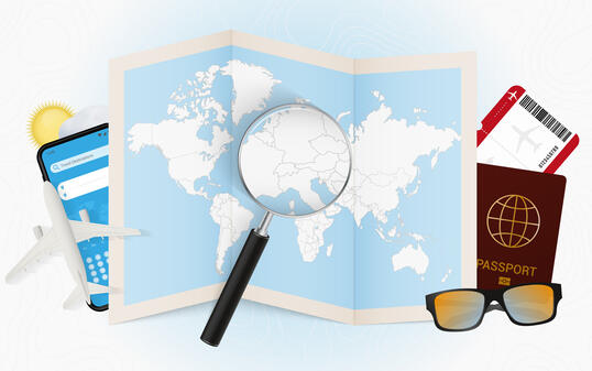 Travel destination Liechtenstein, tourism mockup with travel equipment and world map with magnifying glass on a Liechtenstein.