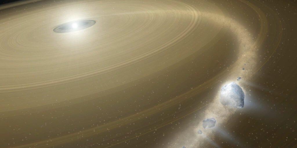 Eine k&uuml;nstlerische Darstellung eines Weissen Zwergs, der einen Kometen zerreisst.