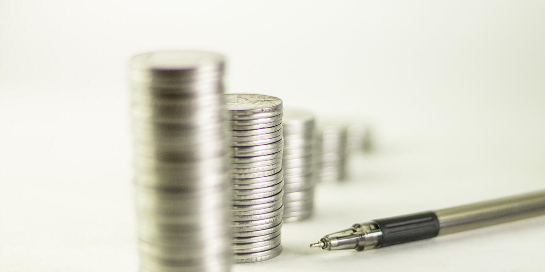 Pen and coins column.