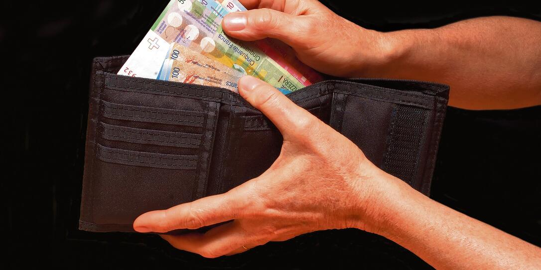 Black wallet with money