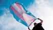 young person with a transgender pride flag