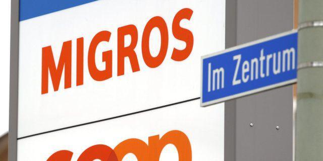 Die Logos der beiden Grossverteiler Migros und Coop