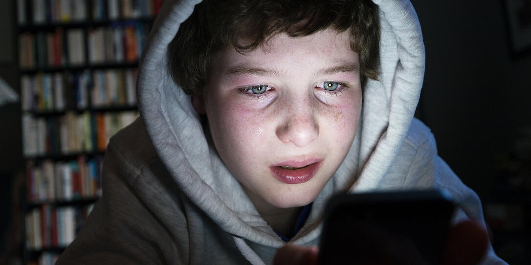 Young Boy Who Is the Victim of Online Bullying