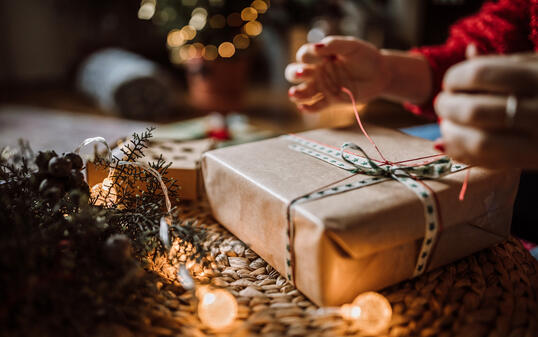 Woman Wrapping Christmas Gifts