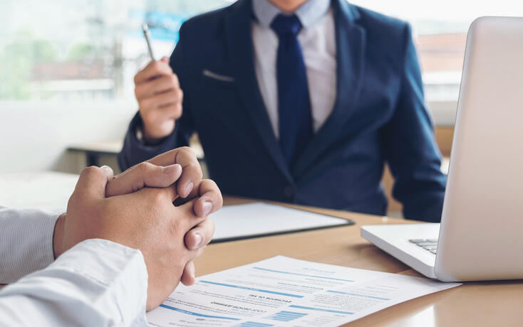 Job application interview. Executive manager hold up pen to Sign Approval, Close up of male hands, man feel worried, stressed, be nervous, Hiring concept