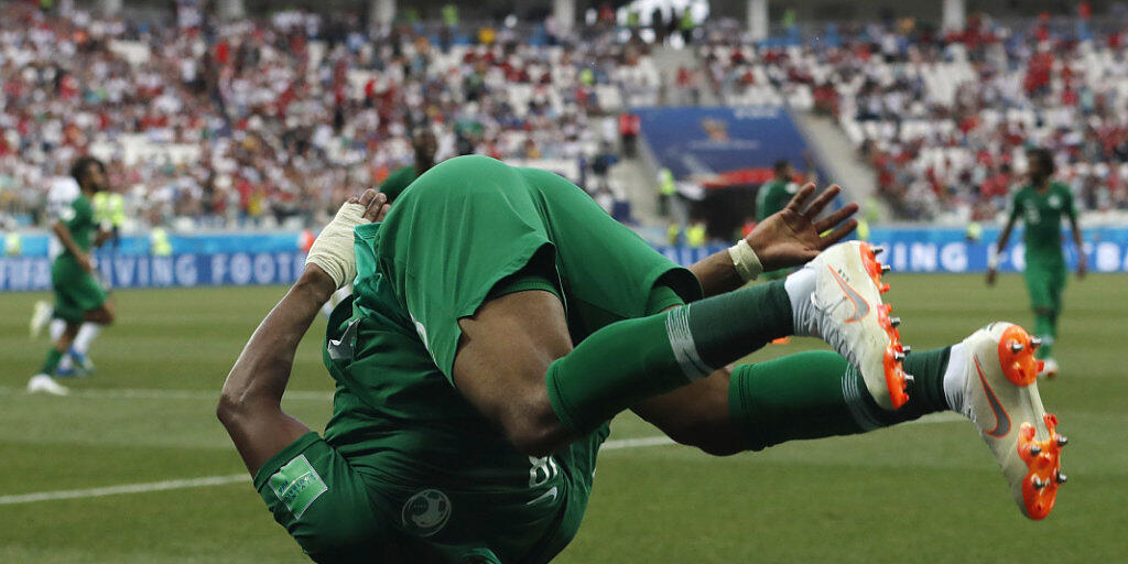 Saudi Arabia's Salem Aldawsari celebrates with a flip after scoring his side's second goal during the group A match between Saudi Arabia and Egypt at the 2018 soccer World Cup at the Volgograd Arena in Volgograd, Russia, Monday, June 25, 2018. (AP Photo/Darko Vojinovic)