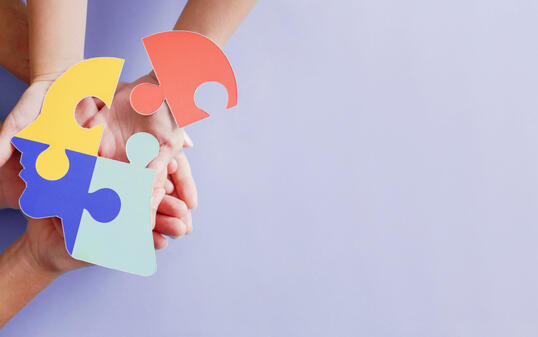 Hands holding jigsaw puzzle head shape, Autism awareness, Autism spectrum disorder (ASD), World Autism Awareness Day