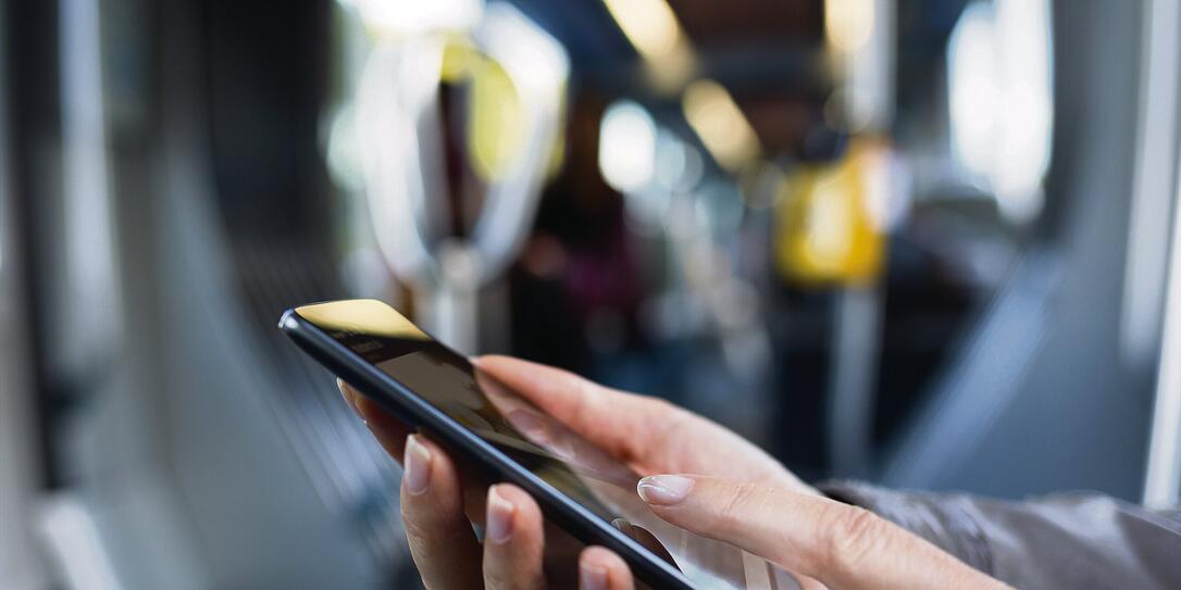 Female using her smart-phone on subway. Metro. Sms, message