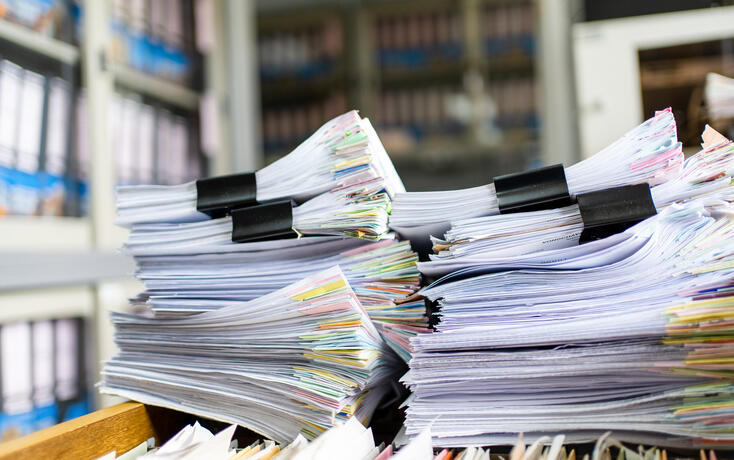 documents achieves paper files for searching information on work desk home office