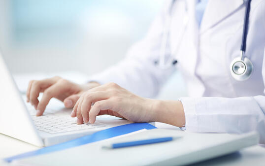 Medical person typing