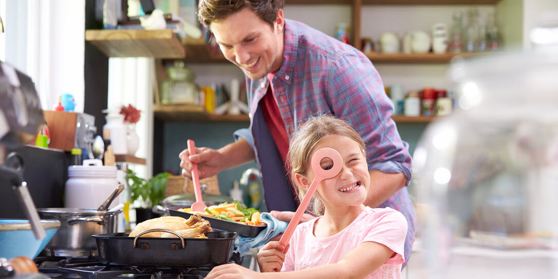 Daughter cooking with father in kitchen Daughter cooking with father in kitchen