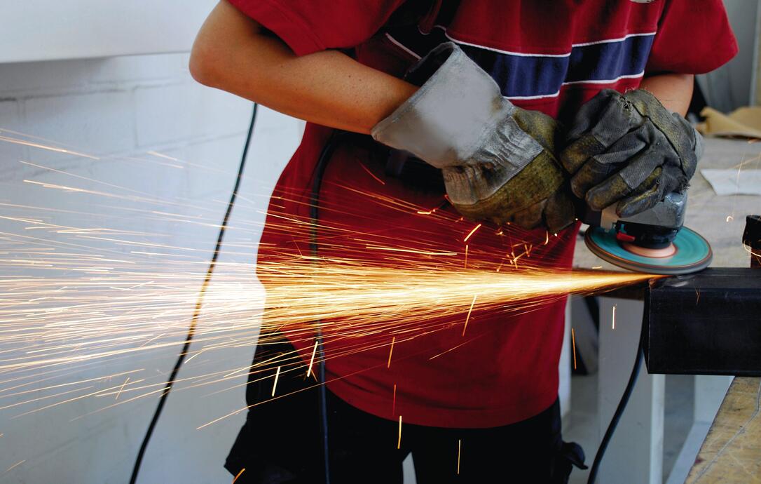 worker with grinder