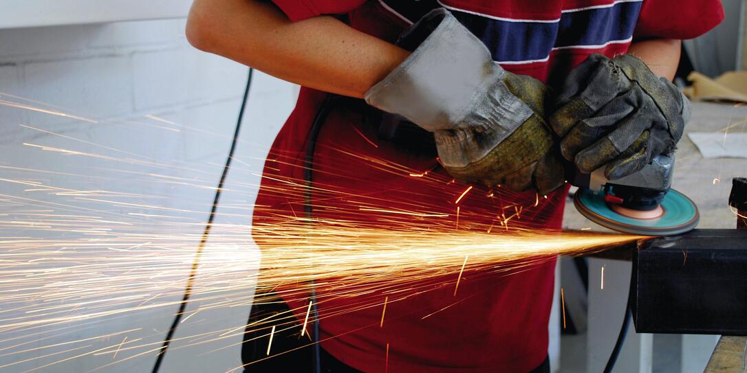 worker with grinder