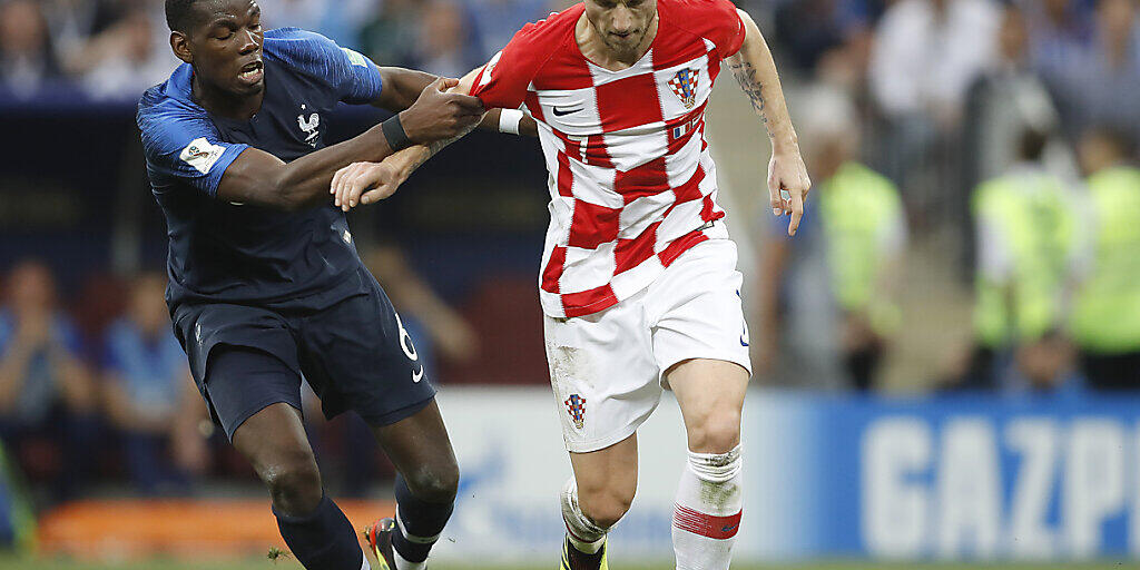 Ivan Rakitic (rechts) während des WM-Finals 2018 im Zweikampf mit Frankreichs Paul Pogba Ivan Rakitic (rechts) während des WM-Finals 2018 im Zweikampf mit Frankreichs Paul Pogba