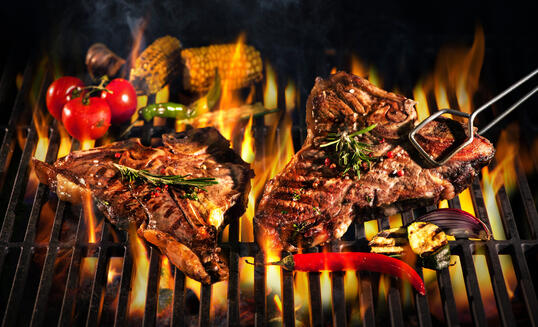 Beef T-bone steaks on the grill