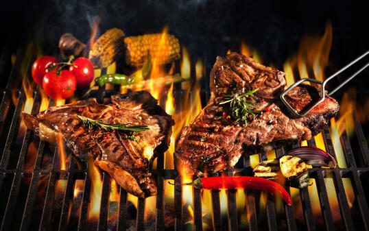 Beef T-bone steaks on the grill