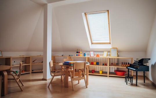 Tables and chairs in modern preschool