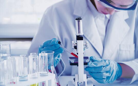 Scientific covid-19 virus antibody sample in laboratory research experiment biotech make cultivate vaccine against virus. Scientist look at microscope, science test tube analyse Chemistry laboratory