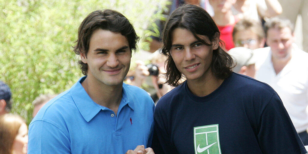 Roger Federer und Rafael Nadal trafen im Juni 2005 in Paris erstmals bei einem Major aufeinander Roger Federer und Rafael Nadal trafen im Juni 2005 in Paris erstmals bei einem Major aufeinander
