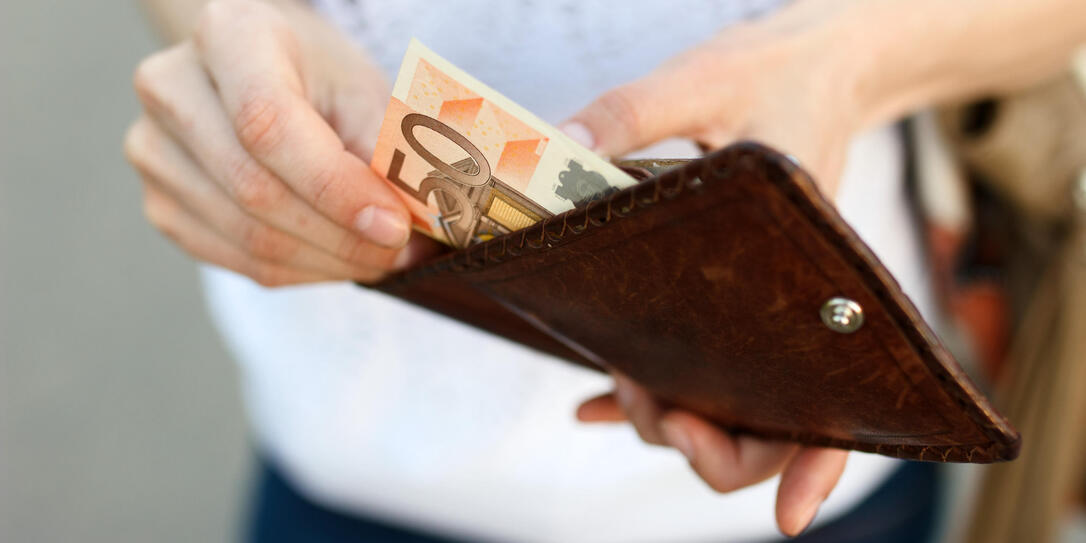 Girl is taking out money from wallet