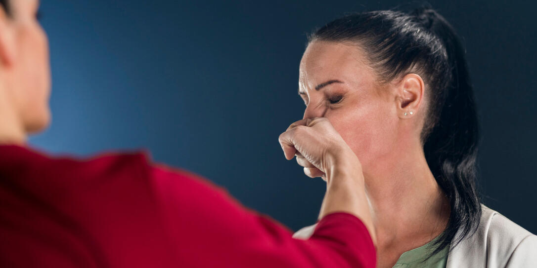 Businesswoman punching her colleague