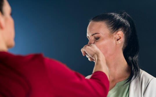 Businesswoman punching her colleague