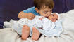 brother with newborn baby