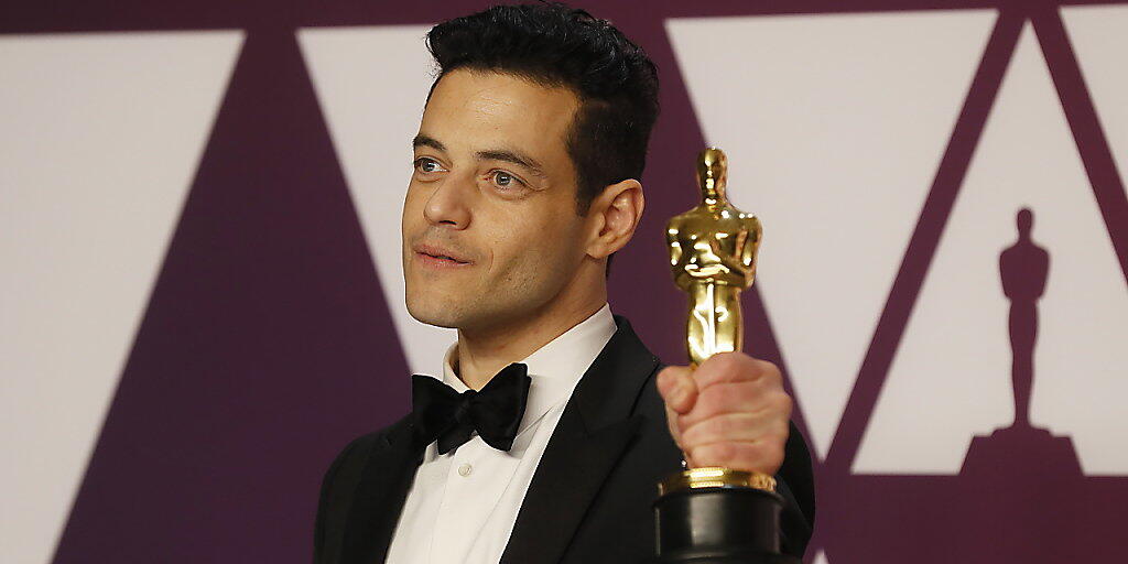 Oscar-Gewinner Rami Malek soll mitten in Verhandlungen um die Rolle von James Bonds neuem Gegenspieler stecken - dies zumindest berichten US-Medien. (KEYSTONE/EPA/ETIENNE LAURENT) Oscar-Gewinner Rami Malek soll mitten in Verhandlungen um die Rolle von James Bonds neuem Gegenspieler stecken - dies zumindest berichten US-Medien. (KEYSTONE/EPA/ETIENNE LAURENT)