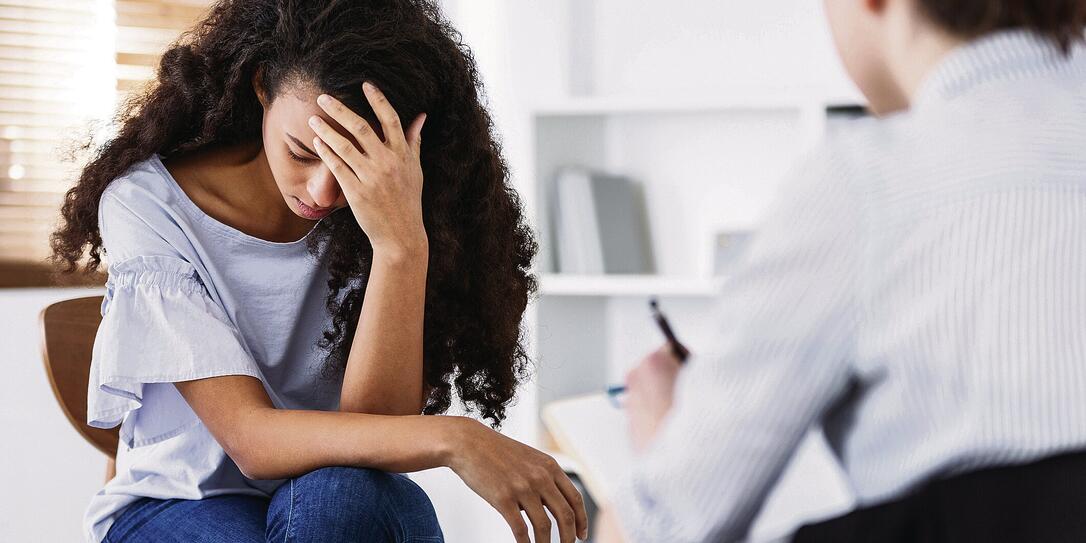 Professional psychotherapies and young woman suffering from ptsd