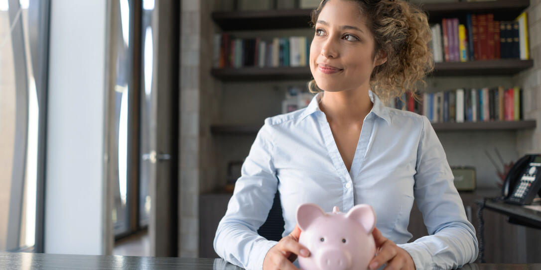 Business woman thinking how to spend her savings