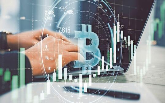 Close up of male hands using laptop with creative round bitcoin hologram on blurry grid background with forex chart. Online banking, cryptocurrency and finance concept. Double exposure.