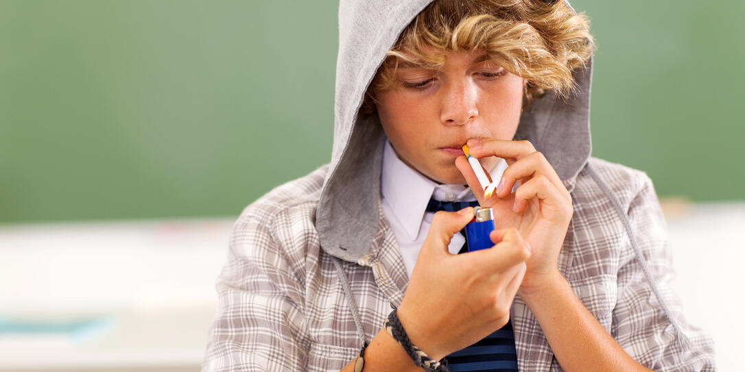 teen boy lighting cigarette teen boy lighting cigarette