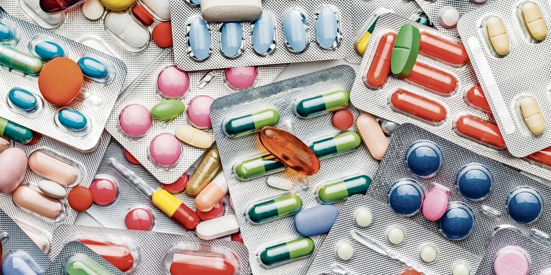 Background of a large group of assorted capsules, pills and blisters