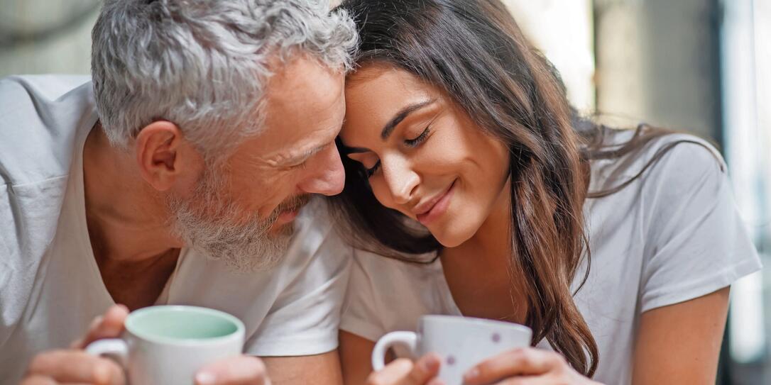 Lovely couple having their mornng coffee together Lovely couple having their mornng coffee together