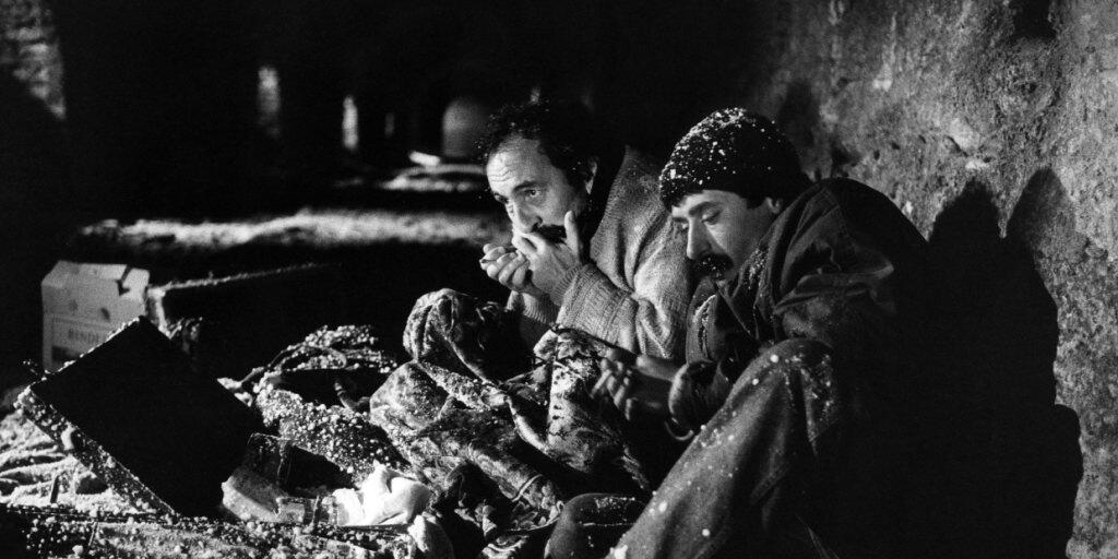 Türkische Darsteller während der Dreharbeiten zum oscarpreisgekrönten Film "Reise der Hoffnung" von Xavier Koller auf dem Splüegenpass im November 1989. Der Film wurde unter anderem mit Unterstützung der SRG produziert.